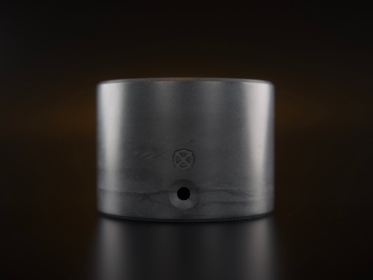 Nox One concrete base, graphite grey on dark background