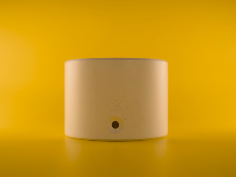 Nox One concrete base, white on yellow background